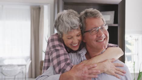 Happy-senior-couple-hugging-each-other-