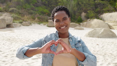 face, heart sign and woman on beach