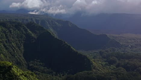 Aerial-panning-view-of-knife-edge-ridges-of-Maui-covered-with-vegetation-and-greenery