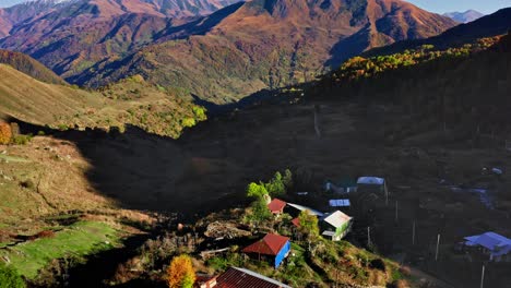 tiny mountain village at caucasus region of georgia in setting of autumn sunset