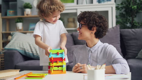 mother and child playing with building blocks