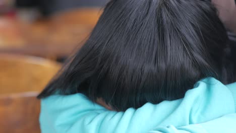 woman sitting with head down