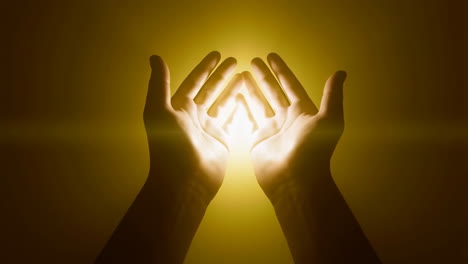 hands holding a glowing light