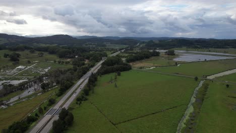 Driving-On-Highway-Through-Green-Fields-On-Cloudy-Day