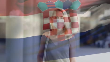 Animation-of-flag-of-croatia-waving-over-woman-wearing-face-mask-during-covid-19-pandemic