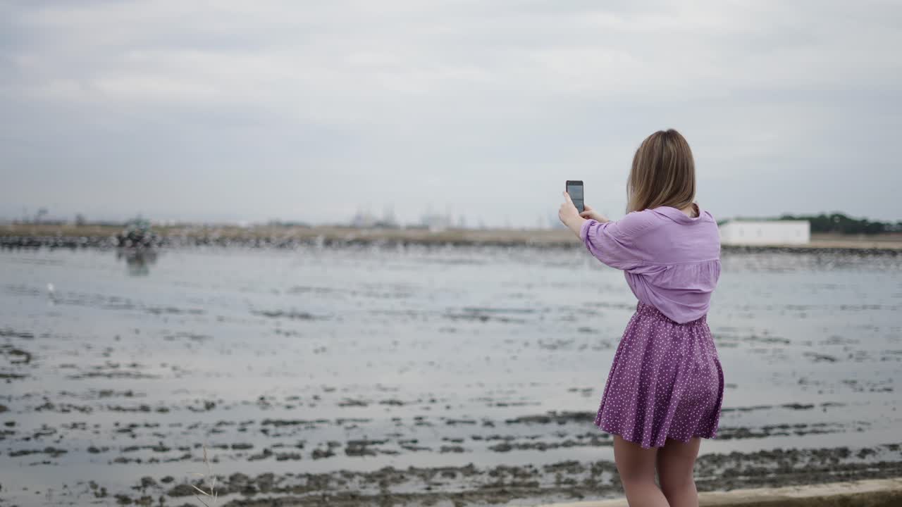 Woman Taking Selfie by the Lake