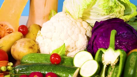 vibrant vegetables arranged on a blue background