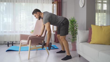 Doing-arm-training-with-dumbbells-at-home.