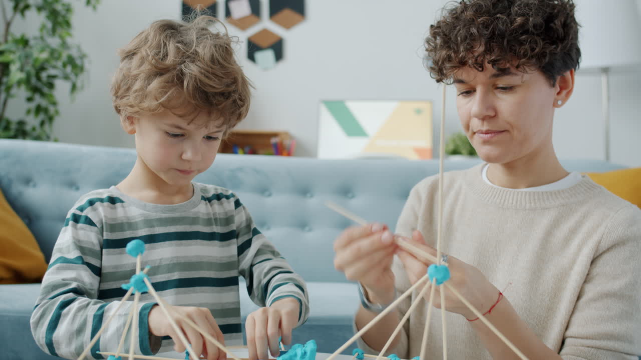 Mother and son playing with building toys