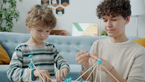 mother and son playing with building toys