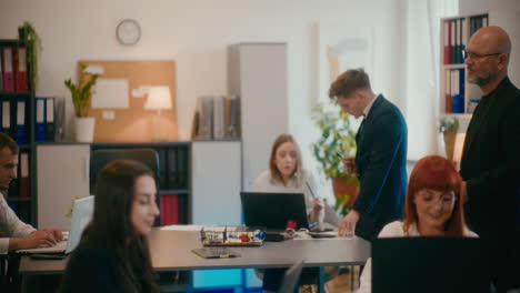 mature manager scolding employee in office.