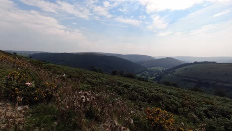 timelapse across vast lush scenic green hazy rural mountain valley countryside