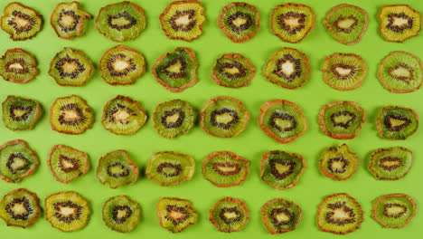 kiwi slices close up background of green, fresh fruit texture.