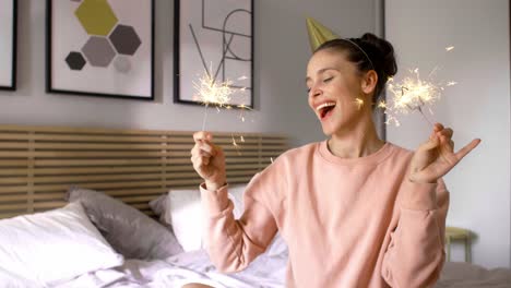 happy woman having fun with sparkler