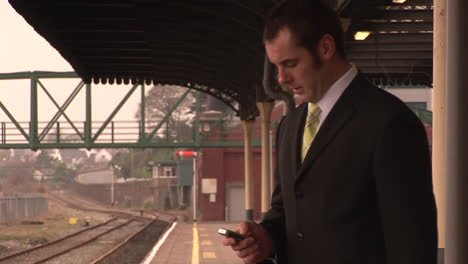 man waiting for train