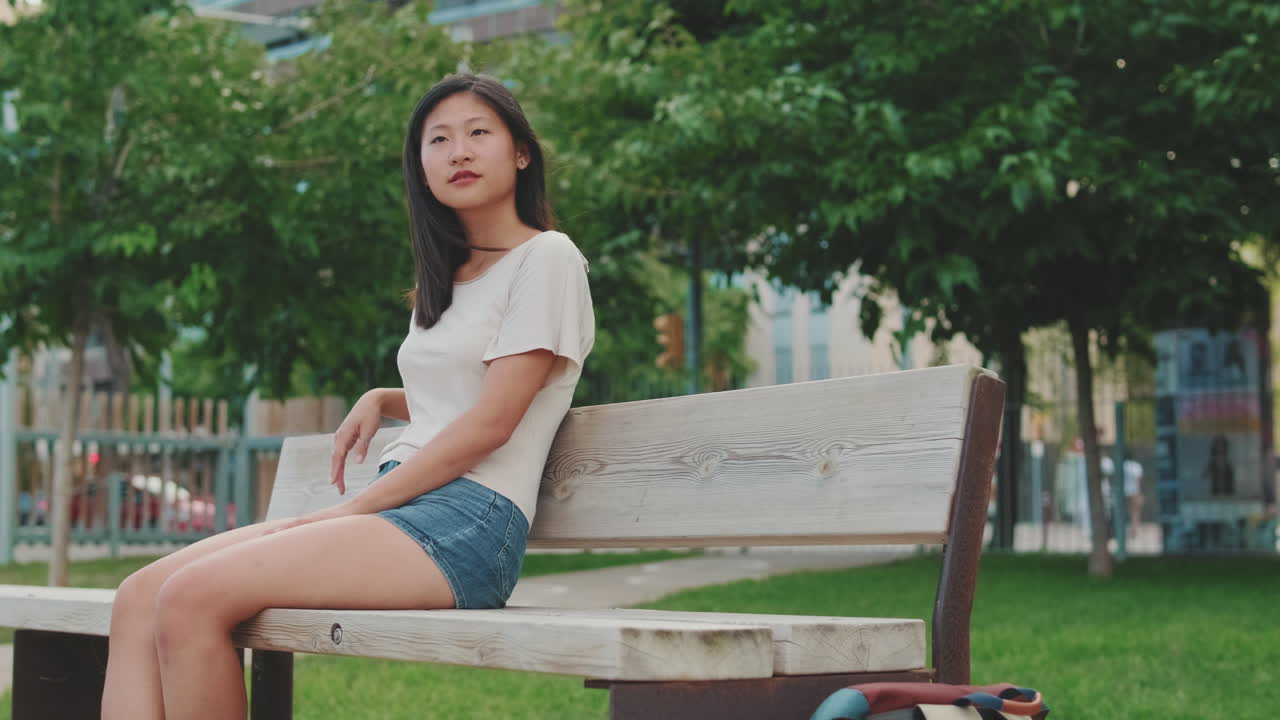 Woman Sitting on Park Bench
