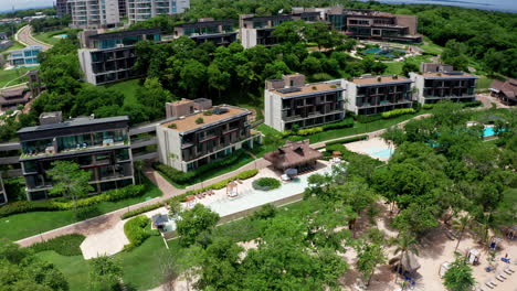 Aerial-drone-view-over-luxury-resorts-on-a-tropical-beach