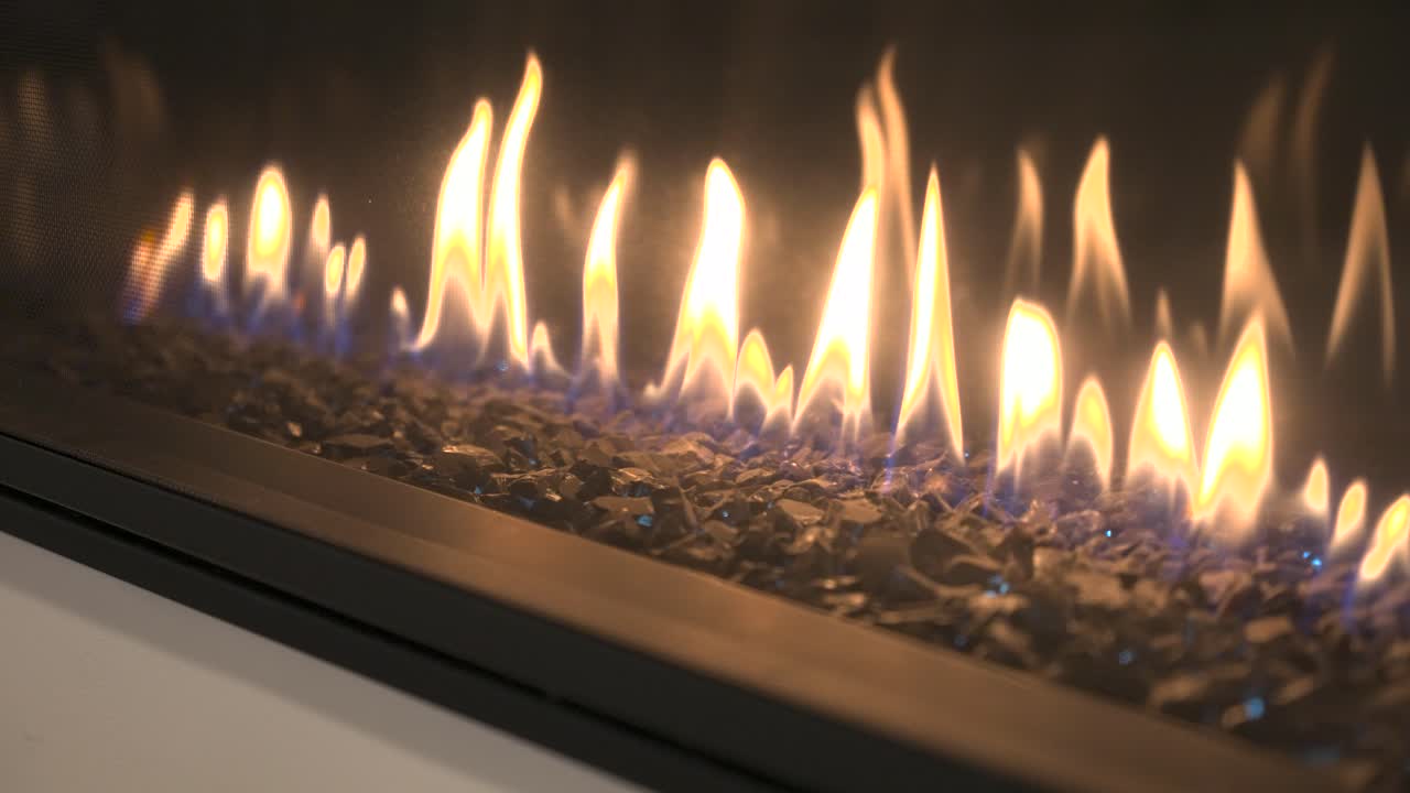 Close Up of a Modern Electric Fireplace with Flames and Rocks