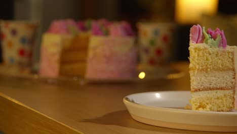 slice of party celebration cake for birthday decorated with icing on table at home 4