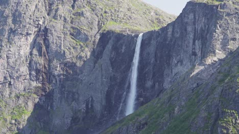 majestic cascading waterfall of mardalsfossen on a sunny day - wide shot