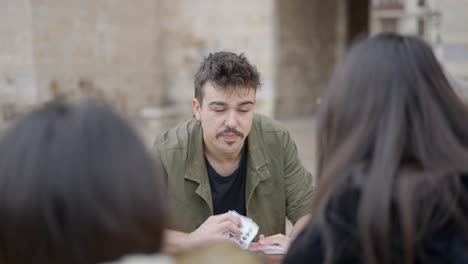 card trick performance in a public space