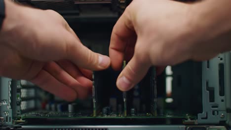 a technician installing ram modules into a server for enhanced performance and capacity in a high-tech computing environment