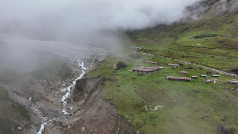 aerial drone fly view at the top of salkantay trek from cusco to machu picchu in the peruvian andes during a sunny and foggy morning, peru, south america, the way on salkantay trek, peru