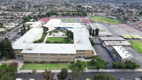 aerial, crenshaw high school, football field over campus, city of los angeles