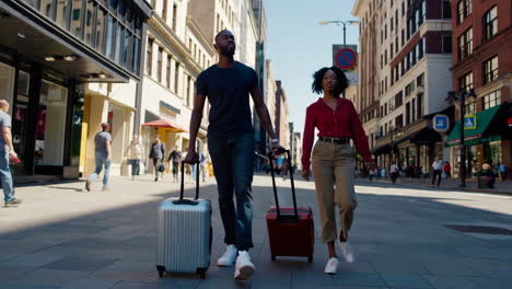 couple navigating a city street with luggage and a map