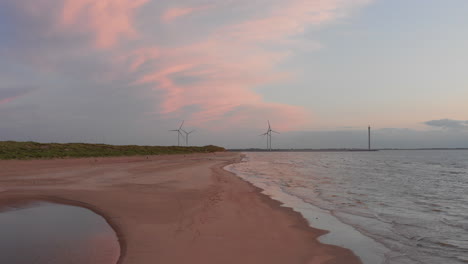 Windturbines-during-sunset-on-the-island-Neeltje-Jans,-the-Netherlands