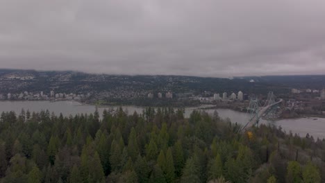 aerial view of stanley park and the lions gate bridge in vancouver, bc in 4k