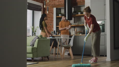 Three--Roomates-Cleaning-Together-Their-Shared-Flat