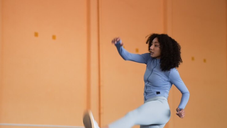 Woman stretching indoors