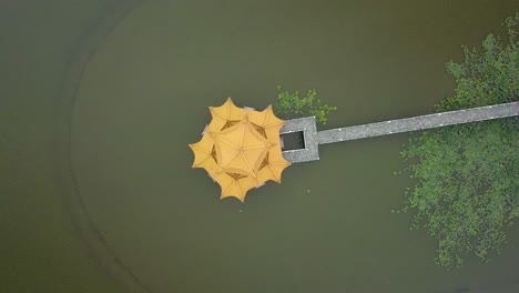 top down view drone shot of wuliting at lotus pond in kaohsiung, taiwan.