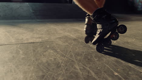 extreme roller skater riding outdoors. man feet in roller blades at park.