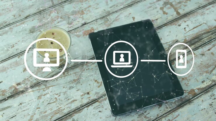 Animation of network of digital icons against digital tablet and coffee cup on wooden surface