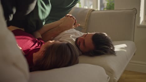 couple playing on a sofa