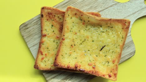 Garlic-bread-on-a-plate-on-table-,