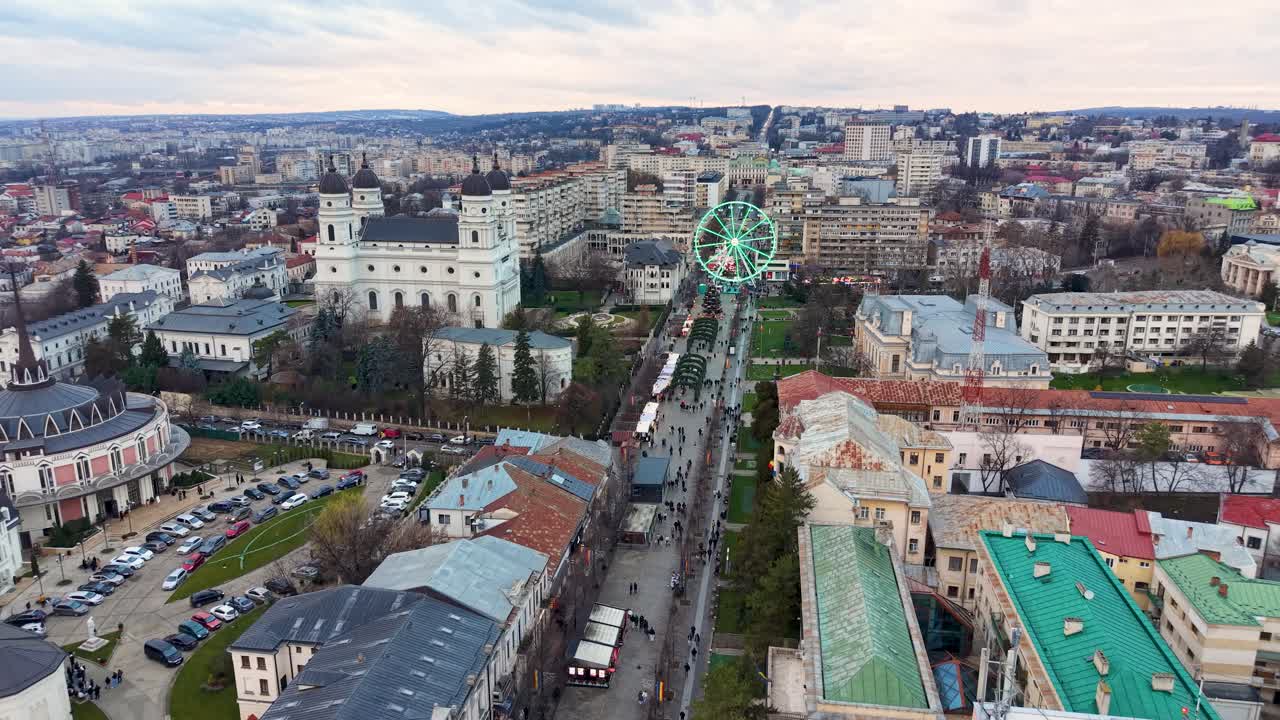 Drone aerial view of Ferris wheel and Christmas market along Ștefan cel Mare Boulevard, Iași, Romania