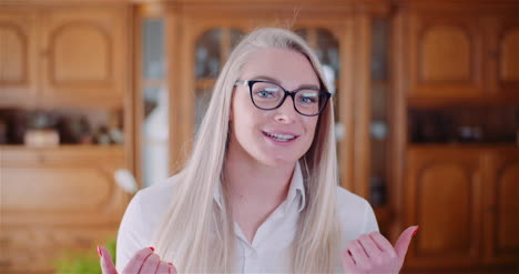 Confident-Businesswoman-Gesturing-In-Office