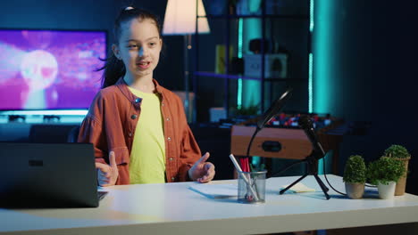 kid arriving in personal studio illuminated with rgb lights, starting shooting internet video