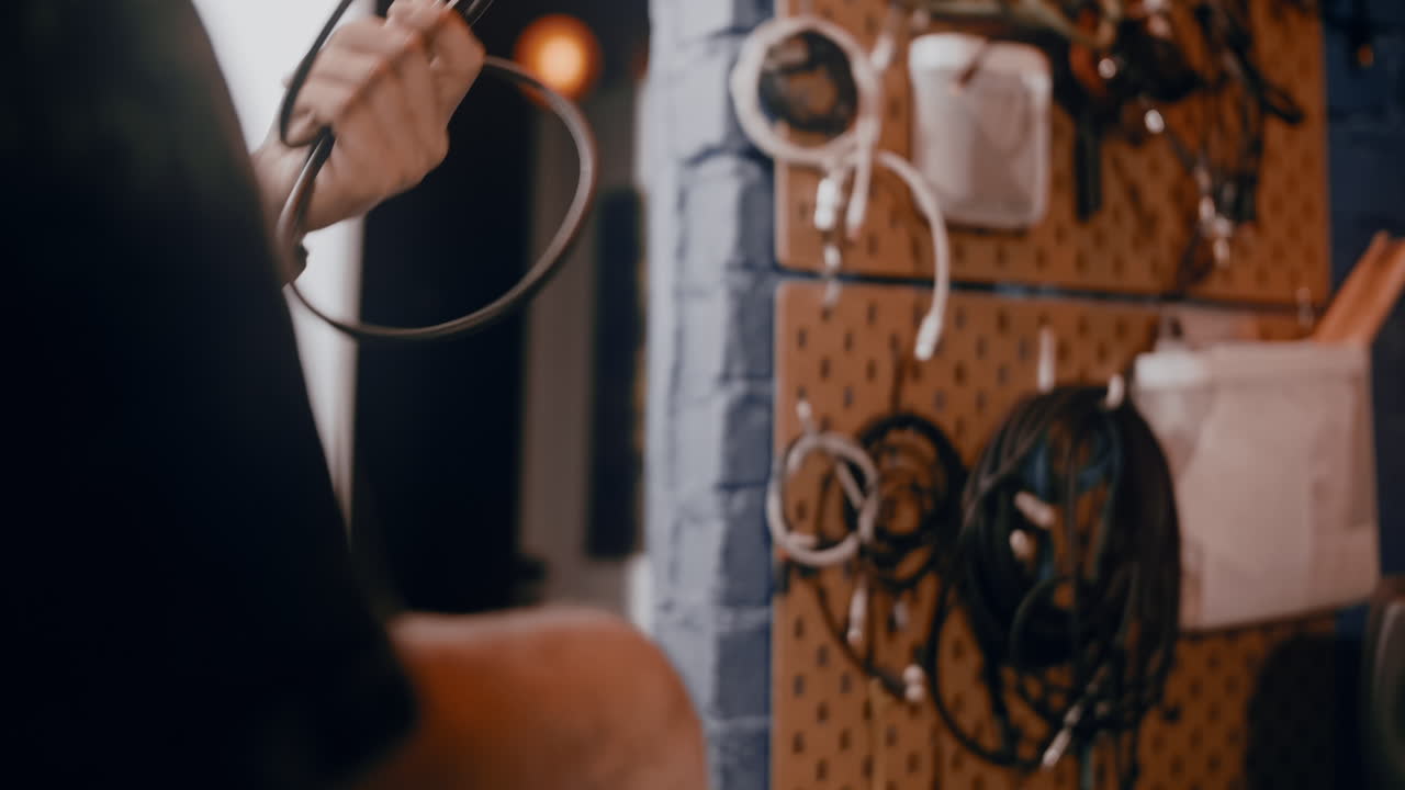 Person organizing cables and equipment