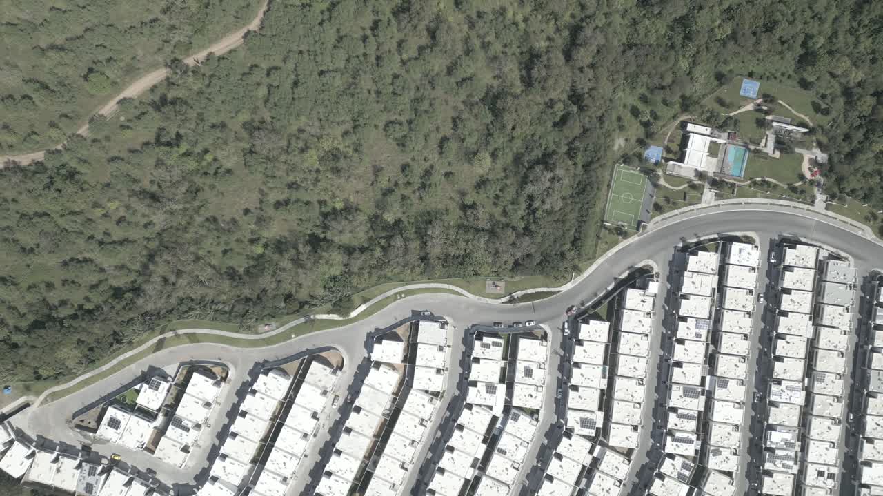 Aerial View of a Modern Residential Community with Solar Panels
