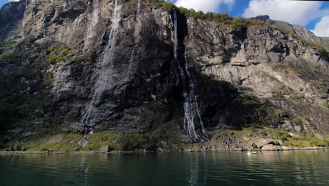 towering rock walls of the geiranger fjord seven sisters waterfall of norway