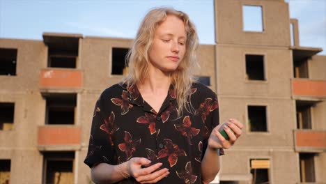 beautiful-young-woman-with-poker-face-playing-with-the-ball-in-slow-motion