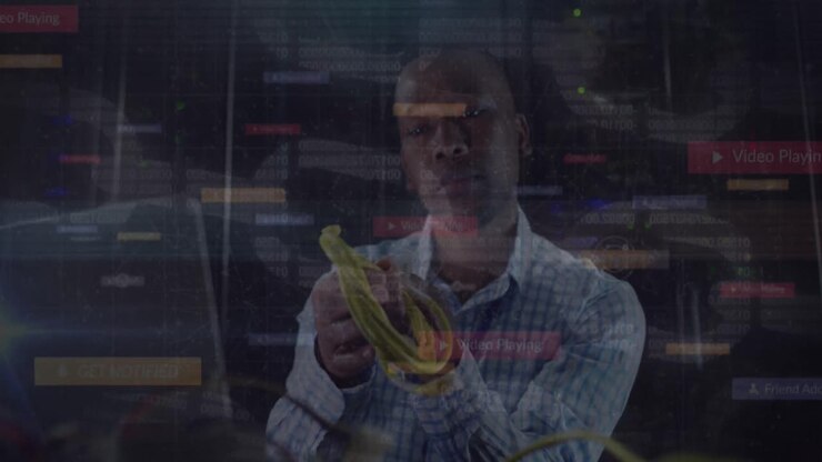 Animation of data processing over african american man using laptop in server room