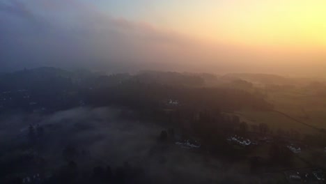 Thick-morning-mist-over-the-Cumbrian,-Lake-District-town-of-Bowness-on-Windermere