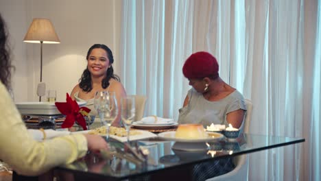 Women Enjoying a Dinner Gathering and Conversation