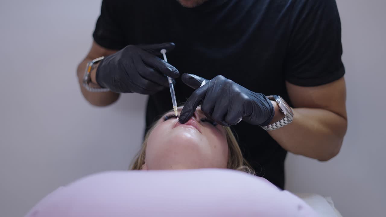 Close-up of a person receiving a cosmetic lip injection
