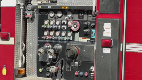 Fire-engine-pump-gauges-and-levers-on-a-Gatineau-fire-truck-in-Quebec,-Canada